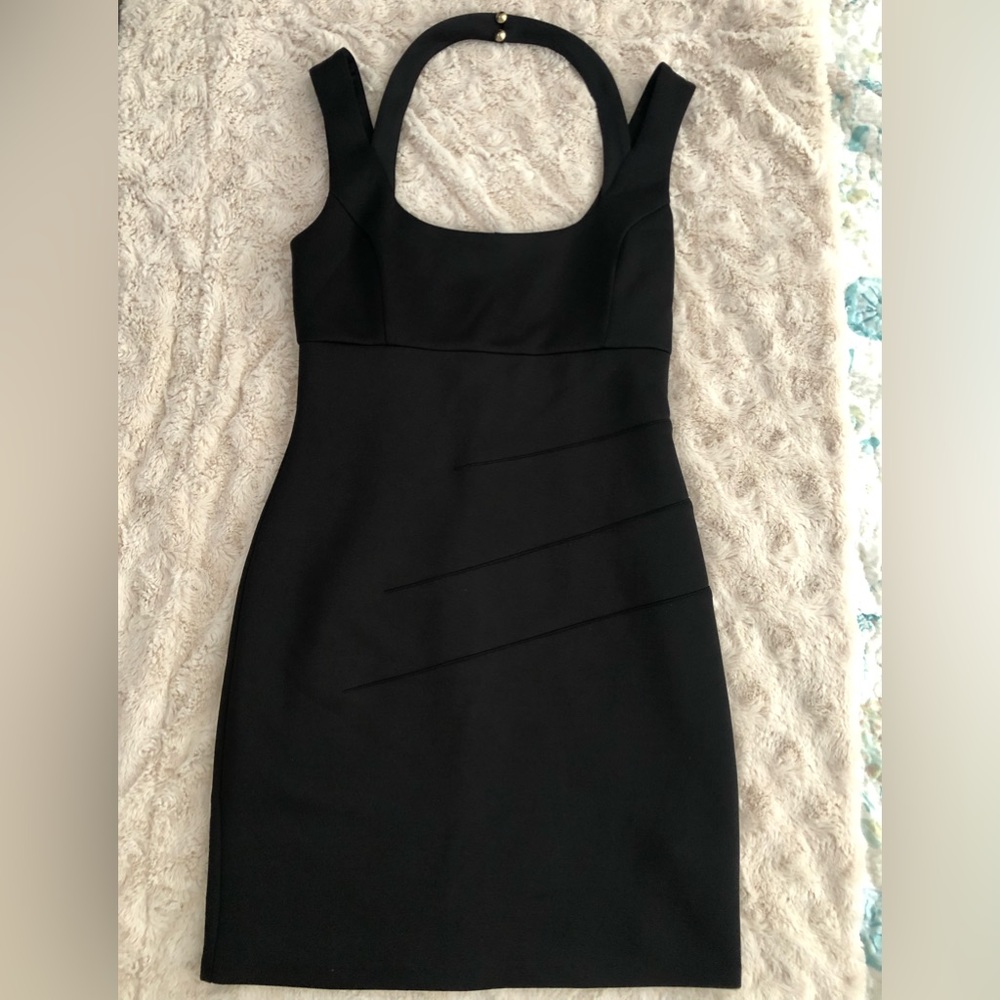 Guess Women’s dress; black zippered with back neck buttons. Size 8